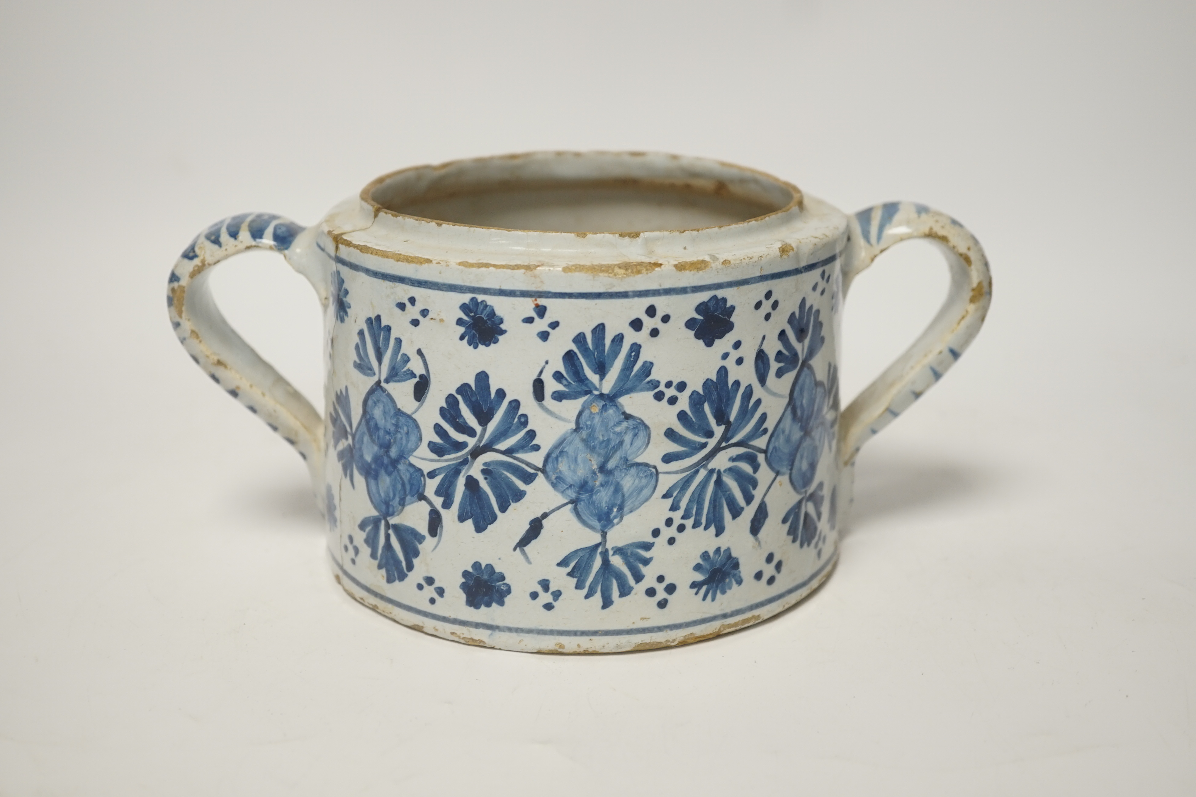 A Delft two handled posset pot, c.1680-1700, 23cm wide including handles